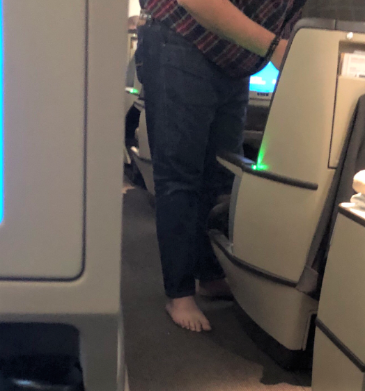 Bare feet, kimchi and a peacock on a plane? Really? Air travelers need to do better.